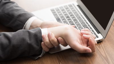 carpal tunnel syndrome pain in a office works wrist