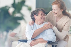 stroke treatment in Saskatoon | Happy patient is holding caregiver for a hand while spending time together. Stroke Rehabilitation, stroke recovery